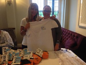 Busy at the registration desk, PPG and PPGBI Membership Managers, Rebekah King and Louise Stapleton-Frappell, show off a PPG t-shirt, one of many gifts for the attendees